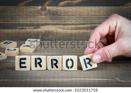 error. Wooden letters on the office desk, informative and communication background