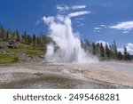 erupting Grand Geyser, in the Upper Geyser Basin of Yellowstone National Park, USA