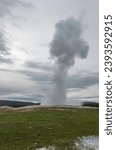 Erupting Old Faithful geyser in Wyoming