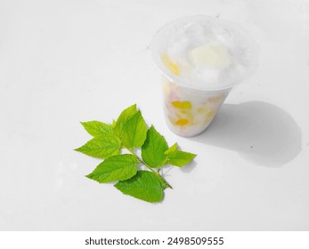 Es buah is a drink consisting of milk mixed with various pieces of fruit and jelly, popular in tropical countries - Powered by Shutterstock