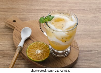 Es Kelapa Jeruk, a typical Indonesian drink made from fresh oranges squeezed with grated young coconut. - Shutterstock ID 2137246337