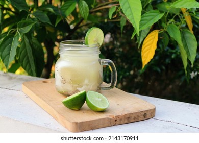 Es kuwut. Traditional fruit cocktail originated from Bali which made from young coconut, honey dew, basil seeds and lime. refreshing es kuwut made from young coconut water. with copy space. 