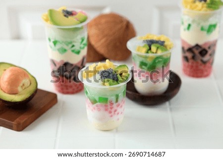 Es Teller Sultan in Plastic Cup, Indonesian Traditional Mix Fruit Popular Street Food 