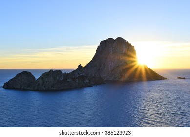 Es Vedra after the sunset, pastel colored sky at the mystic rock of Es Vedra, Ibiza Island.