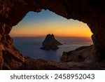 Es Vedra island sunset view from the Eye of Es Vedra cave, Sant Josep de Sa Talaia, Ibiza, Balearic Islands, Spain