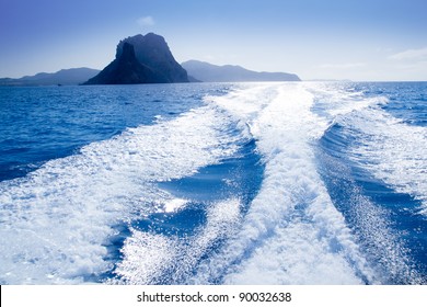 Es Vedra Islet And Vedranell Islands With Boat Wake In Mediterranean Spain