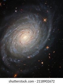 ESA Hubble: Galactic Tranquility. The lazily winding spiral arms of the spectacular galaxy NGC 976 fill the frame of this image from the NASA ESA Hubble Space Telescope.