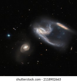 ESA Hubble and NASA: Strike. The subject of this image is a group of three galaxies, collectively known as NGC 7764A.
