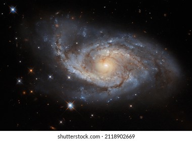 ESA Hubble: Sail of Stars. The spiral arms of the galaxy NGC 3318 are lazily draped across this image from the NASA ESA Hubble Space Telescope.