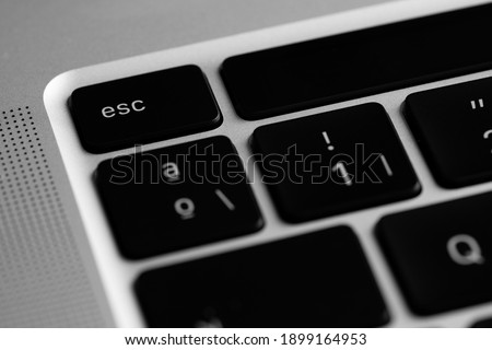 Esc key of a black keyboard. Macro photography