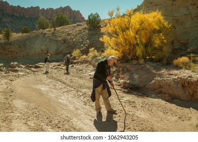 Escalante, Utah - 10/31/2009:  Three people exploring a dry riverbed in Grand Staircase-Escalante National Monument.