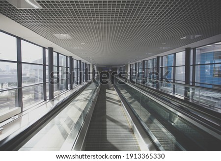 Escalator at airport terminal or shopping mall. Nobody