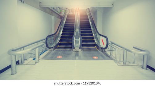 Escalator in business office building. Moving up staircase. . electric escalator. yellow bands. metal line steel. yellow gray steel line.