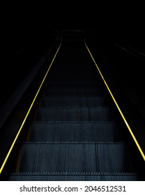 Escalator with lightstrip down to the darkness