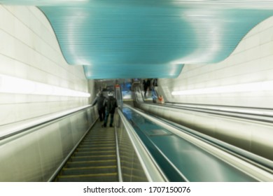 Escalator in a modern metro. Beautiful design of the station. Blurred.