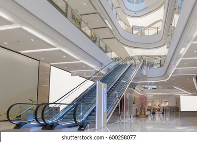 Escalator And Modern Shopping Mall Interior