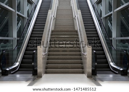 Escalator stairs going up to the light
