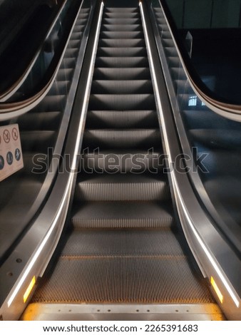 Escalator. Stairway to heaven at night. Beautiful escalator at night.