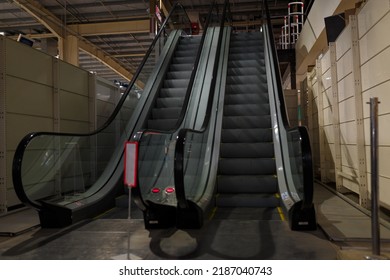Escalator In Supermarket On The First Floor. Modern Convenience And Technology In Architecture Of Urban Buildings