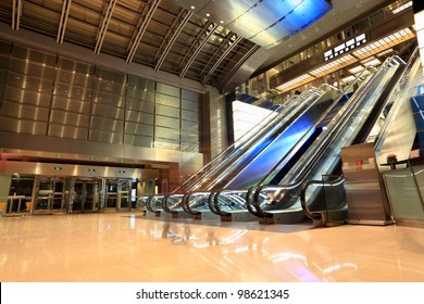 Escalators In The Modern Lobby At Night