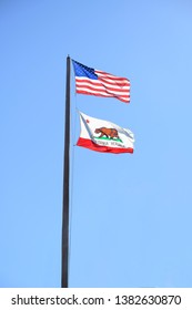 Escondido, California - February 19,, 2019: Republic California Flag And USA American Flag On A Flag Pole.