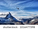 escue helicopter over the Matterhorn mountain in Switzerland