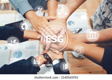 ESG concept. Criteria environmental social and corporate governance in sustainable ethical business.Group of people joining hands and representing concept for sustainable business and environment. - Shutterstock ID 2140565955