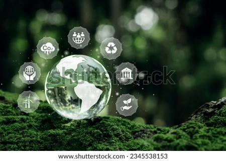 ESG concept.Crystal earth on moss with nature background.ESG icon for Environment Social and Governance, World sustainable environment concept.