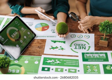 ESG data presentation with professionals analyzing digital trends
Engineers analyzing charts and discussing eco-friendly building project for sustainable development
