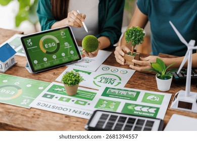 ESG data presentation with professionals analyzing digital trends
Engineers analyzing charts and discussing eco-friendly building project for sustainable development
