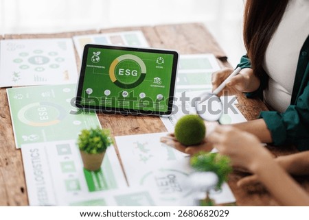 ESG data presentation with professionals analyzing digital trends
Engineers analyzing charts and discussing eco-friendly building project for sustainable development
