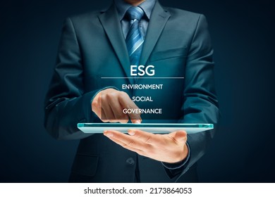 ESG - environment, social and governance - criteria for socially responsible investing concept. Businessman with digital tablet and ESG. - Shutterstock ID 2173864053