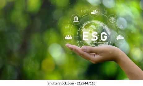 ESG icon concept. Environment in renewable hands. Nature, earth, society and governance SG in sustainable business on networked connections on green background. environmental icon
