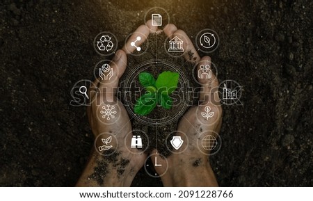 ESG icon concept in the woman hand for environmental, social, and governance by using technology of renewable resources to reduce pollution and carbon emission . 