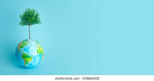 ESG modernization (environmental social governance) conservation and CSR policy. Ecology and nature protection concept. Living tree growing from planet earth on a pure colored banner background