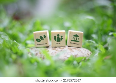  ESG on a wooden block is a concept for sustainable corporate development. Taking into account the responsibility in 3 main areas: environment, society and good governance - Shutterstock ID 2178572867