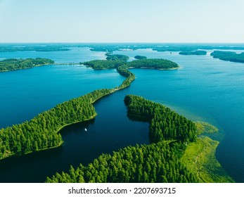 Esker road in Punkaharju in the middle of lake Saimaa, Finland - Shutterstock ID 2207693715