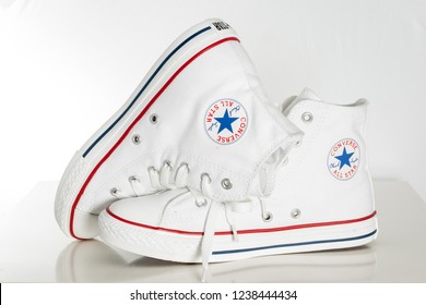 ESKISEHIR, TURKEY - APR 29, 2010: White Converse Sneakers On White Desk