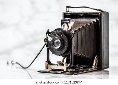 ESKISEHIR , TURKEY - AUGUST 28, 2018: Antique Ernemann Dresden folding camera on marble background