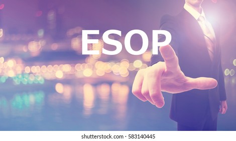 ESOP concept with businessman on blurred city background  