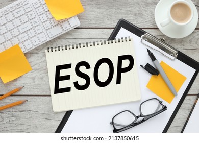 ESOP text on notebook near computer keyboard and yellow stickers