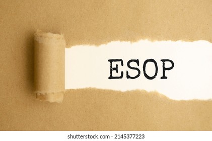 ESOP, text on white paper on torn paper background.