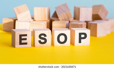 ESOP word construction with letter blocks and a shallow depth of field, business concept. ESOP - short for employee stock ownership plan