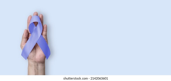 Esophageal and stomach cancer awareness month, and Gastroesophageal Acid Reflux Disease (GERD) Awareness Week with Periwinkle color ribbon on hand support - Shutterstock ID 2142063601