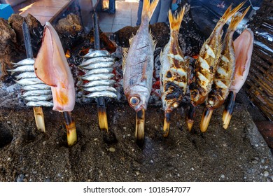 Espeto Fish Food, Traditional Fish Meal At Malaga, Andalusia. Fish And Anchovies On Stick Barbecue