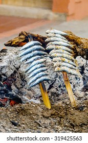 Espetos. Skewer Of Fresh Sardines Cooked Directly In The Fire. Typical Food In The Coast Of Andalusia