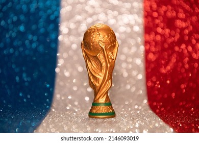Vitória, Espirito Santo, Brazil - April 14 2022: Copy of world cup trophy on bright blue, white and red background, french flag colors