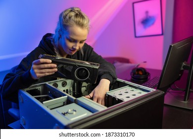 E-sport Gamer Girl Installing New GPU Video Card in Her Gaming PC