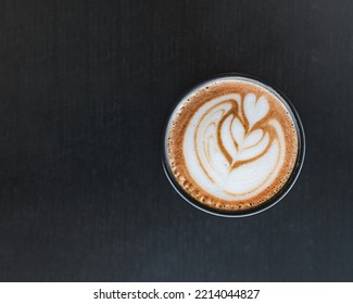 Espresso Coffe Cup Top Down Picture In Black Background With Heart Art Mixed With Milk. Barista Coffe Art With Latte Milk On Top. Delicious Espresso Latte Coffe Wallpaper.