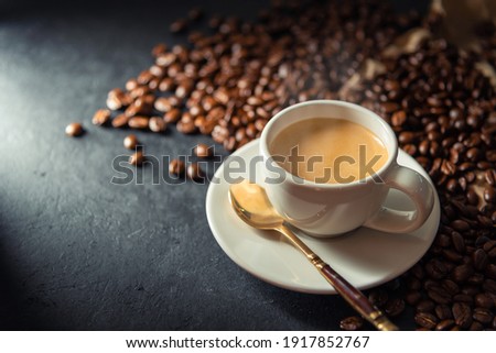 Espresso coffee With coffee beans in the morning background.